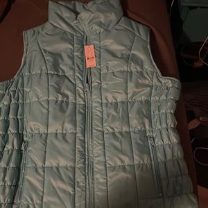 Light blue puffy vest with tags & real pockets
